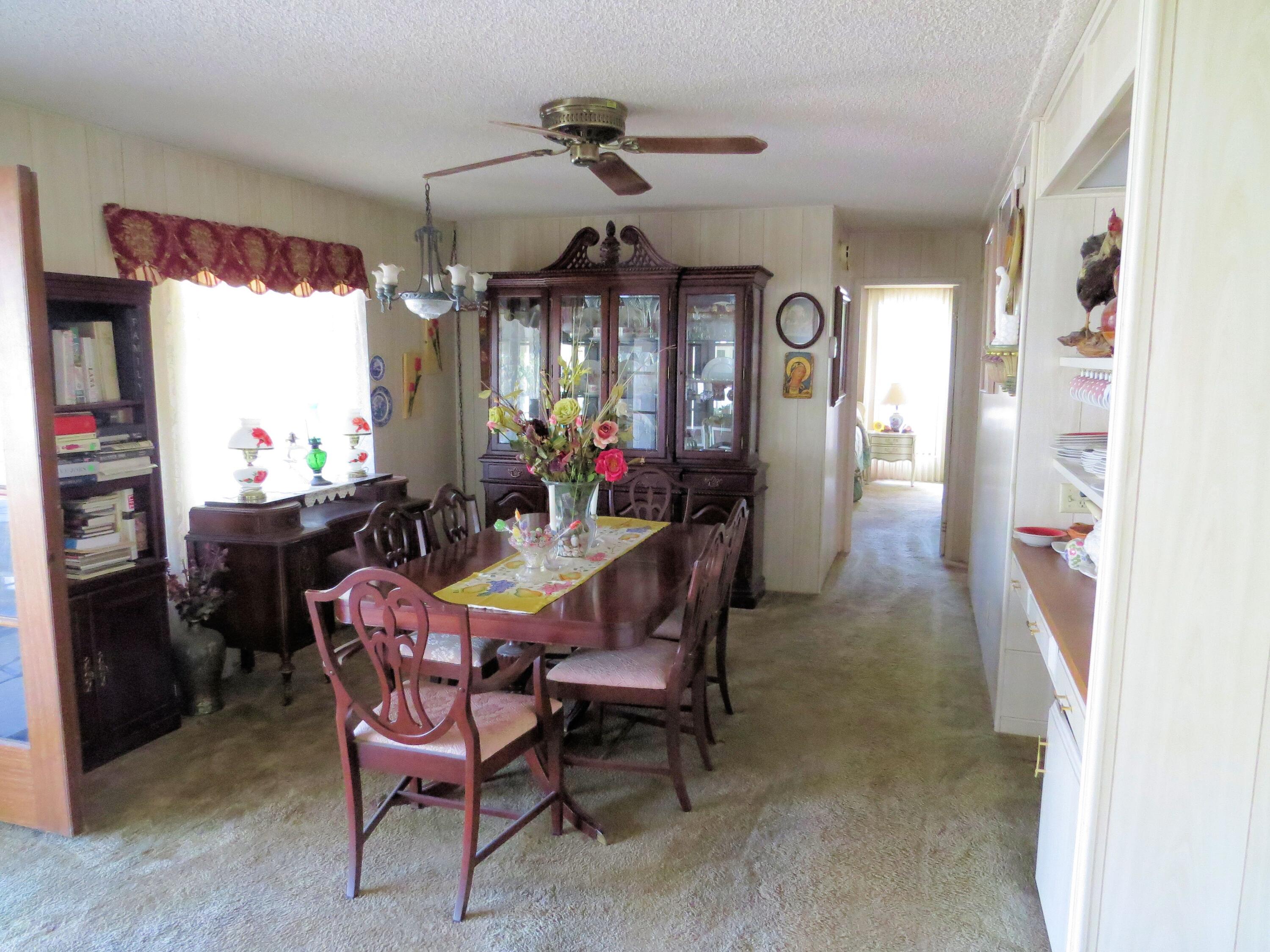 34980 Serenade Thousand Palms, CA 92276 - Photo 17 of 37 a view of a dining room with furniture and window