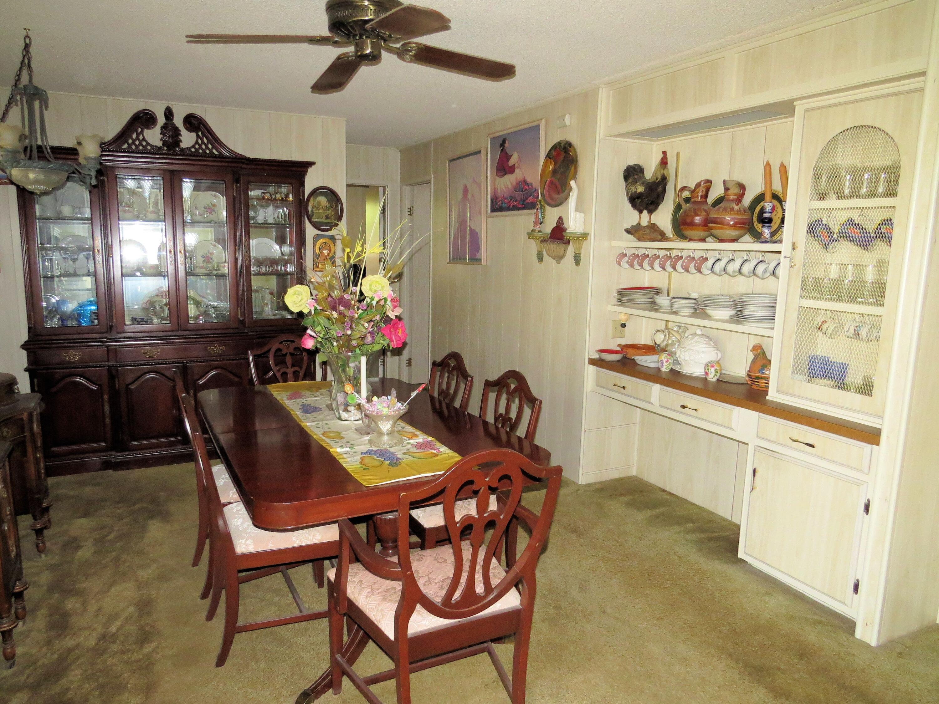 34980 Serenade Thousand Palms, CA 92276 - Photo 18 of 37 a view of a dining room with furniture and chandelier