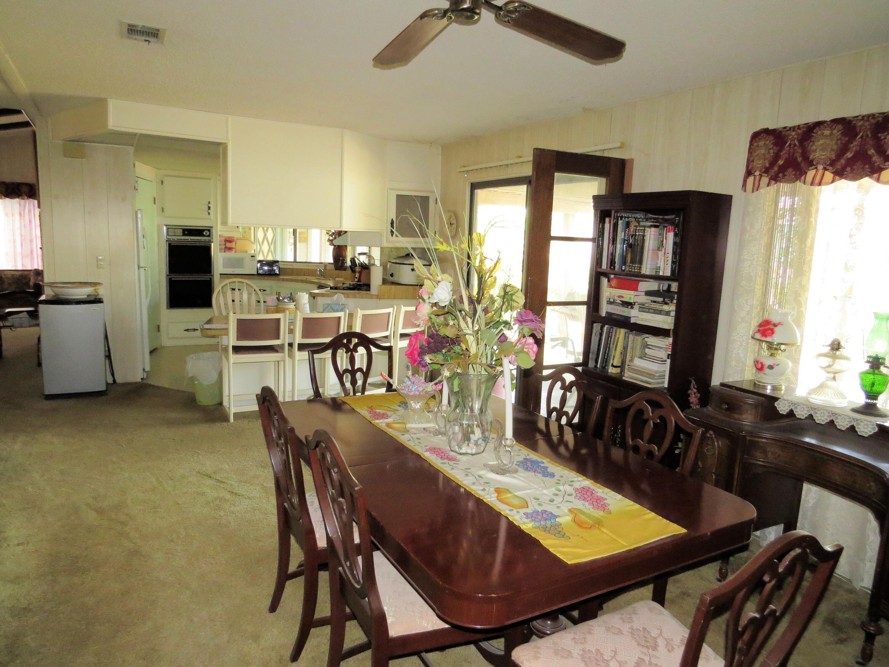 34980 Serenade Thousand Palms, CA 92276 - Photo 19 of 37 a view of a dining room with furniture