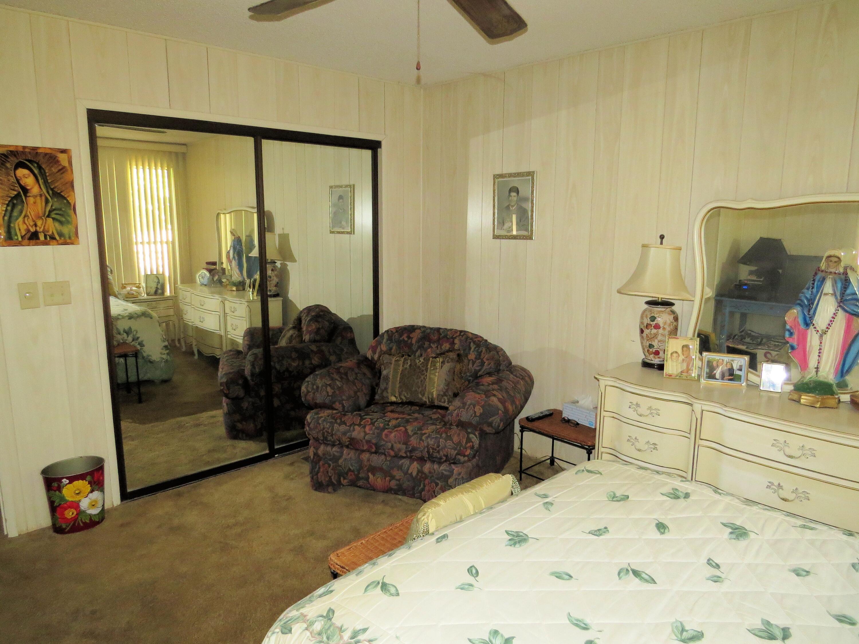 34980 Serenade Thousand Palms, CA 92276 - Photo 21 of 37 a living room with furniture and a flat screen tv