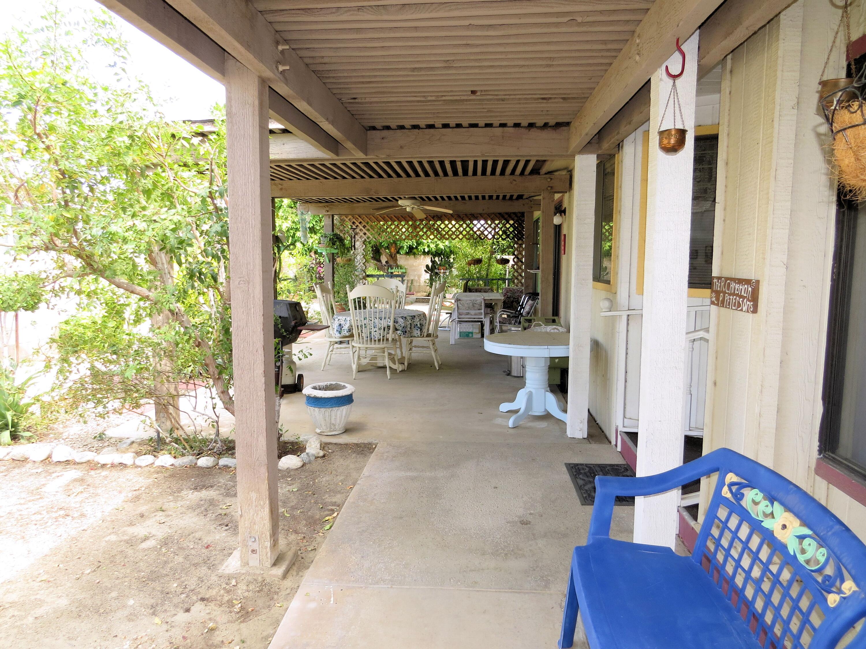 34980 Serenade Thousand Palms, CA 92276 - Photo 31 of 37 a living room with furniture and a large window