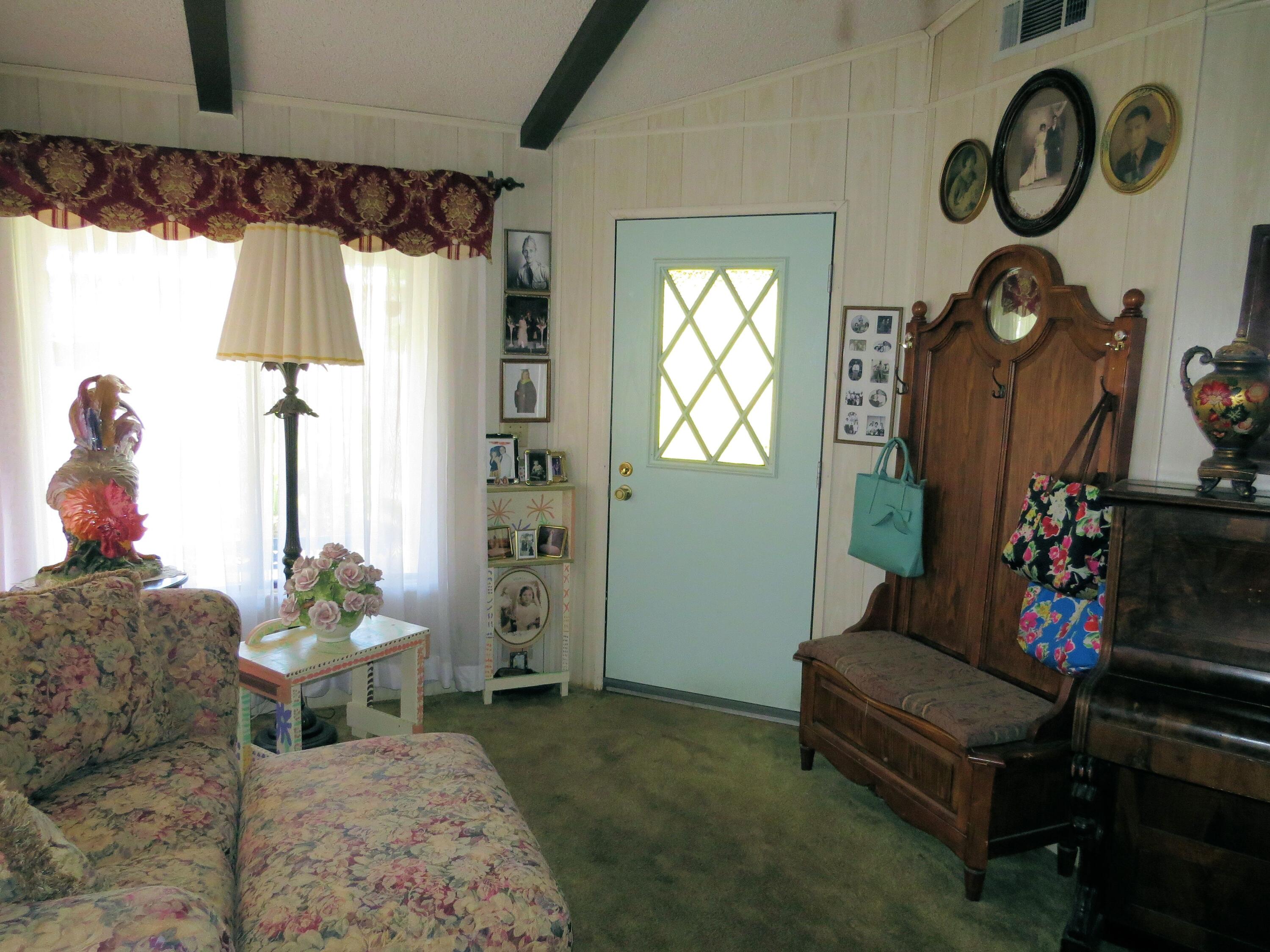 34980 Serenade Thousand Palms, CA 92276 - Photo 5 of 37 a living room with furniture and a window
