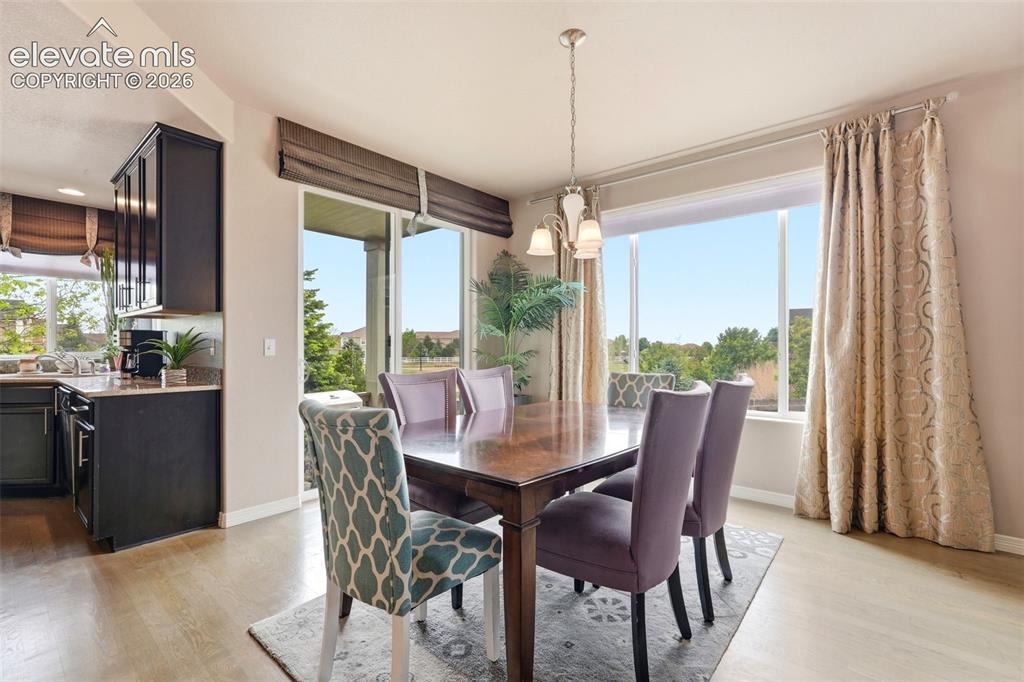 2264 Reed Grass Way Colorado Springs, CO 80915 - Photo 14 of 50 a view of a dining room with furniture window and outside view
