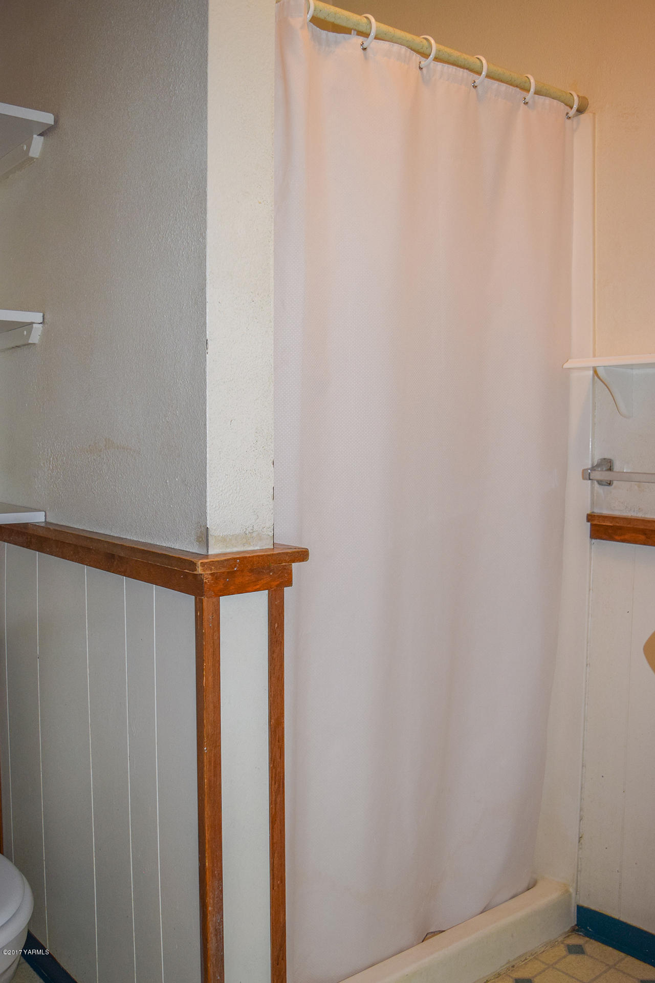 1001 Division Road Zillah, WA 98953 - Photo 11 of 24 a bathroom with a shower curtain and sink