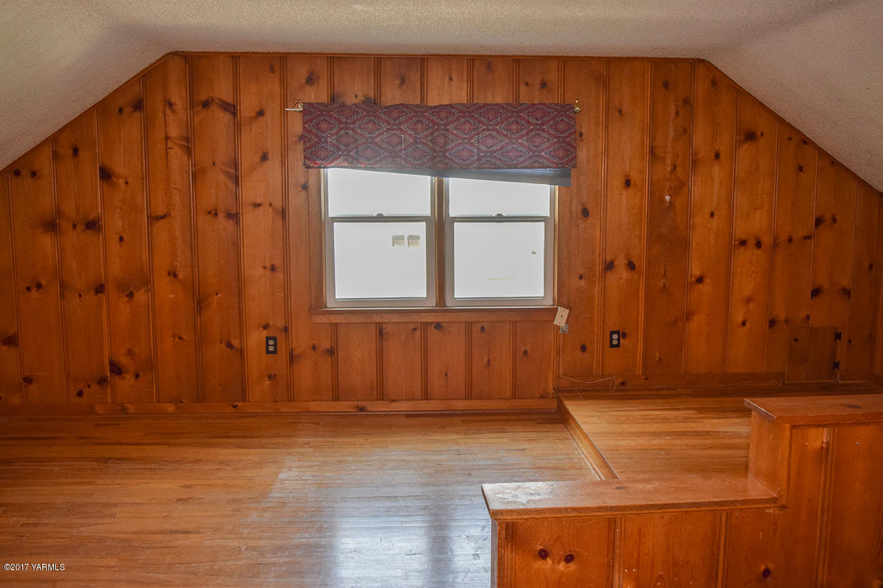 1001 Division Road Zillah, WA 98953 - Photo 13 of 24 a view of door with wooden walls