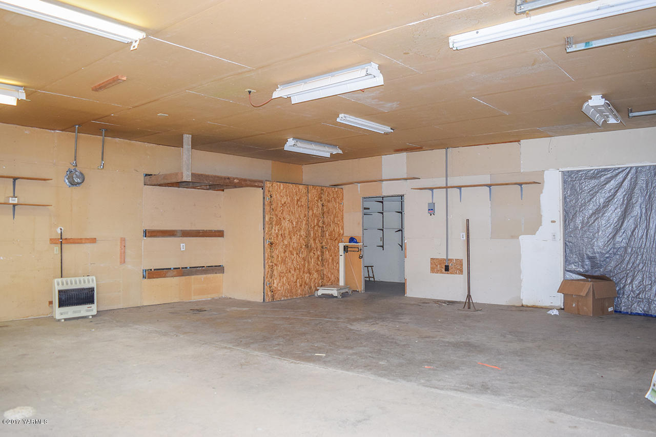 1001 Division Road Zillah, WA 98953 - Photo 20 of 24 a view of a storage & utility room with a sink