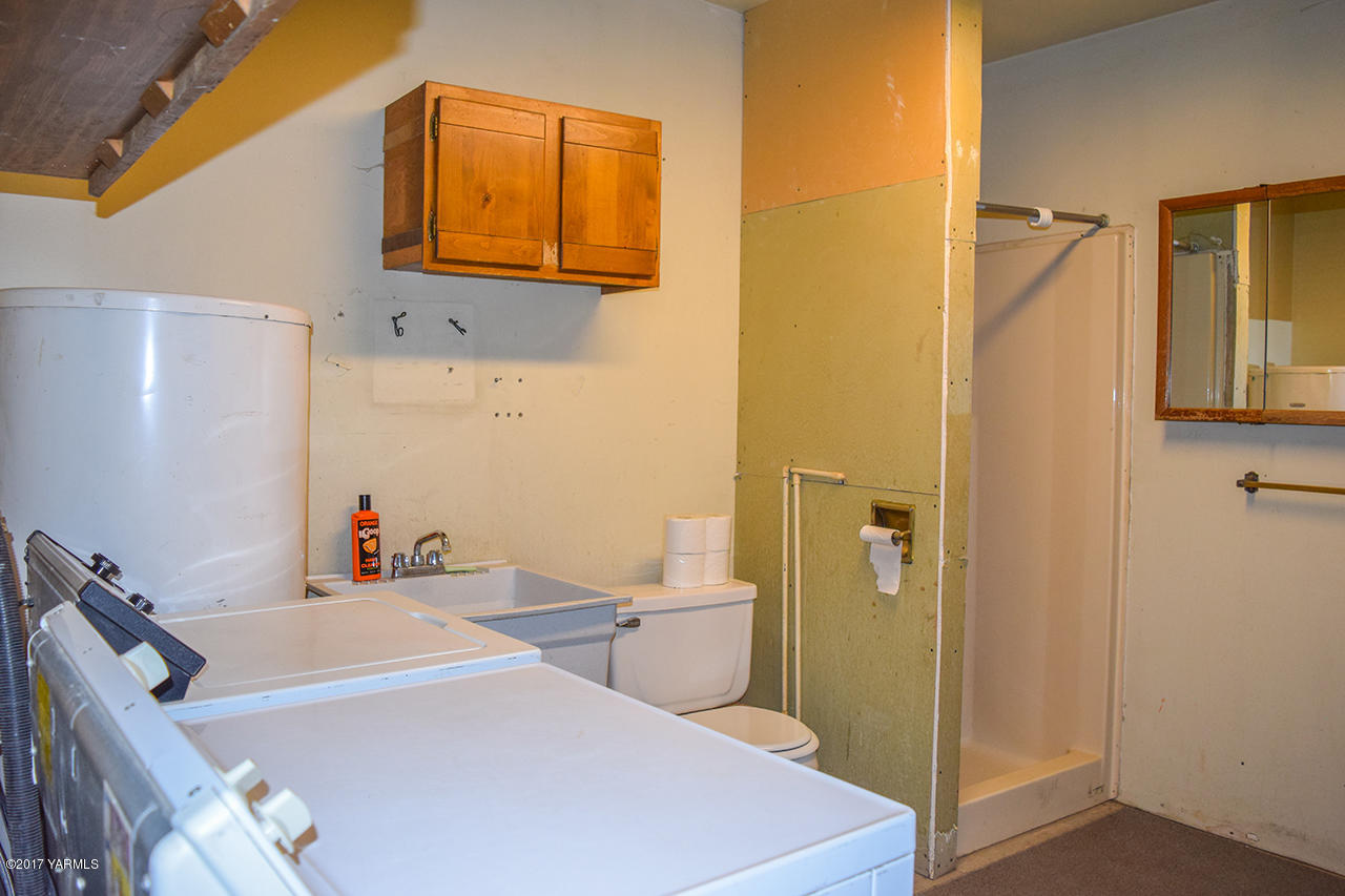 1001 Division Road Zillah, WA 98953 - Photo 21 of 24 a bathroom with a sink and a mirror