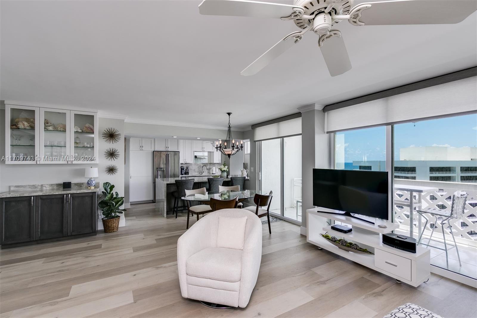 1200 South Ocean Boulevard, Unit PHF Boca Raton, FL 33432 - Photo 16 of 65 a living room with furniture and a flat screen tv