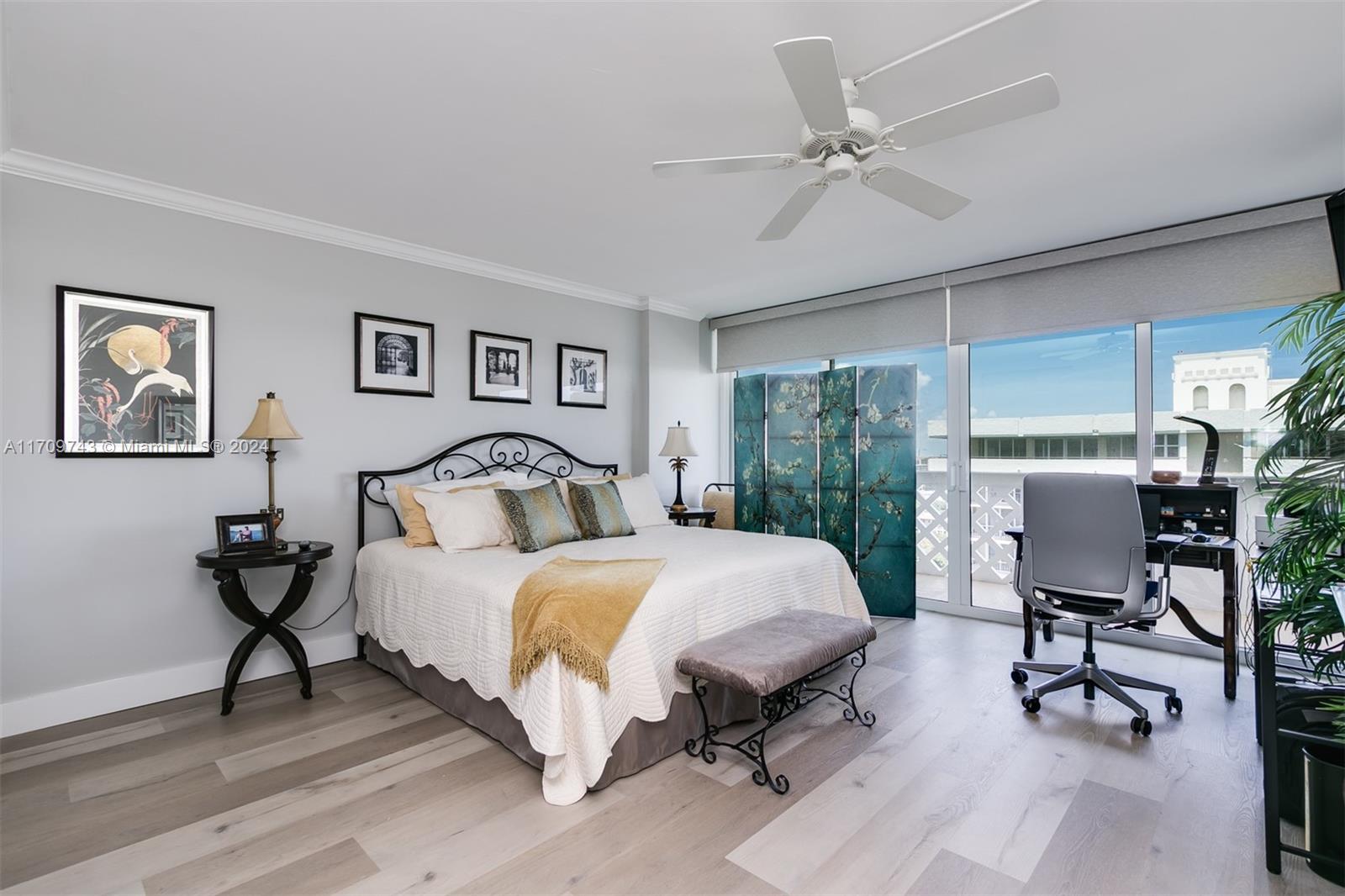 1200 South Ocean Boulevard, Unit PHF Boca Raton, FL 33432 - Photo 17 of 65 a bedroom with a bed and a chandelier