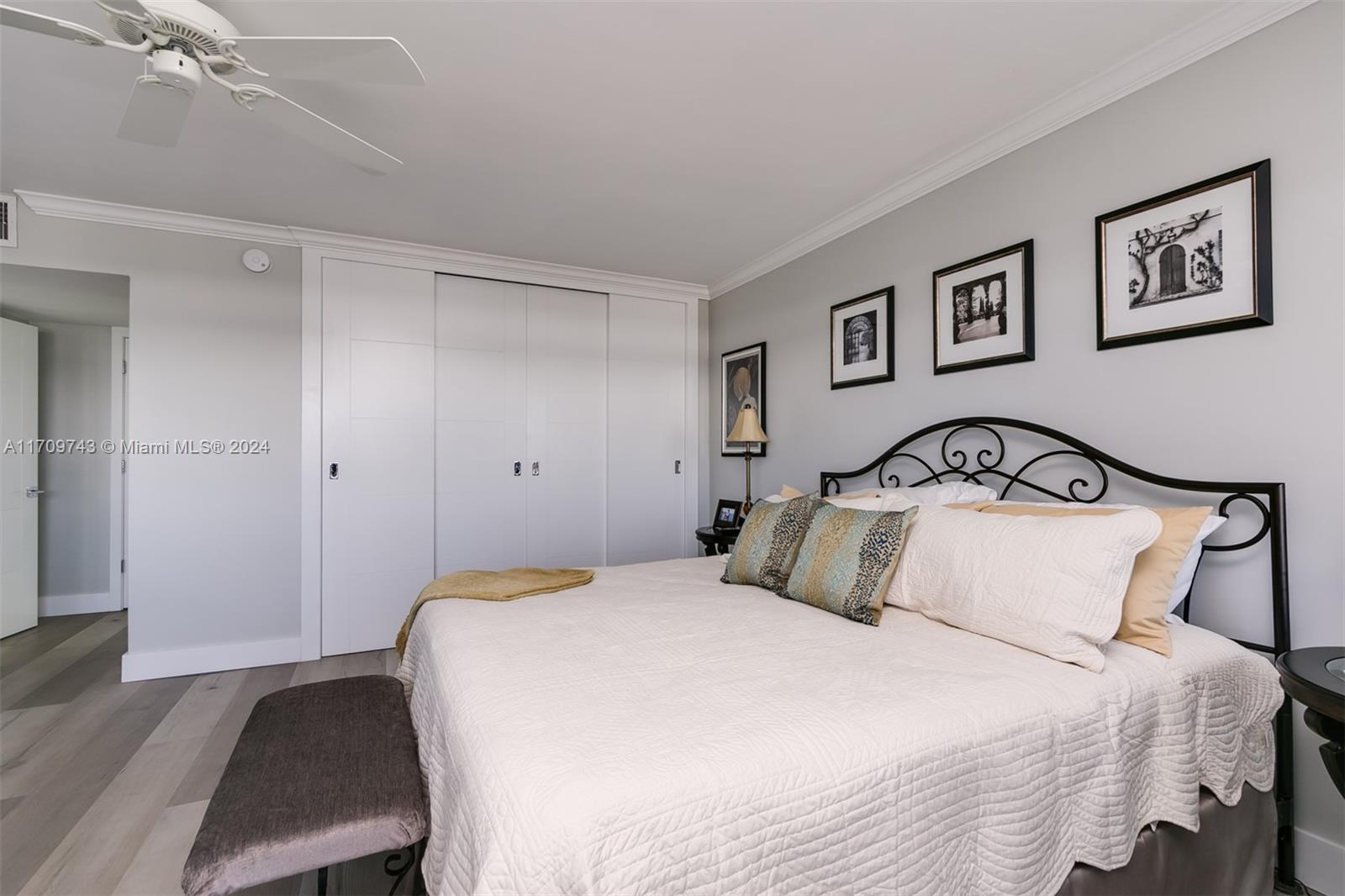 1200 South Ocean Boulevard, Unit PHF Boca Raton, FL 33432 - Photo 19 of 65 a bedroom with a large bed and a painting on the wall
