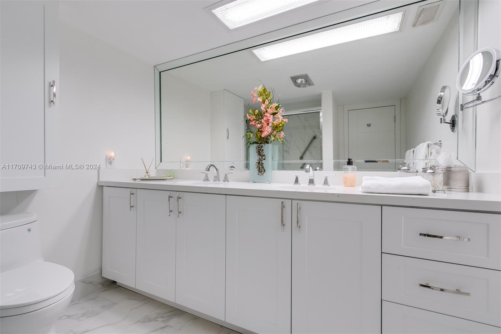 1200 South Ocean Boulevard, Unit PHF Boca Raton, FL 33432 - Photo 20 of 65 a bathroom with a sink and a mirror