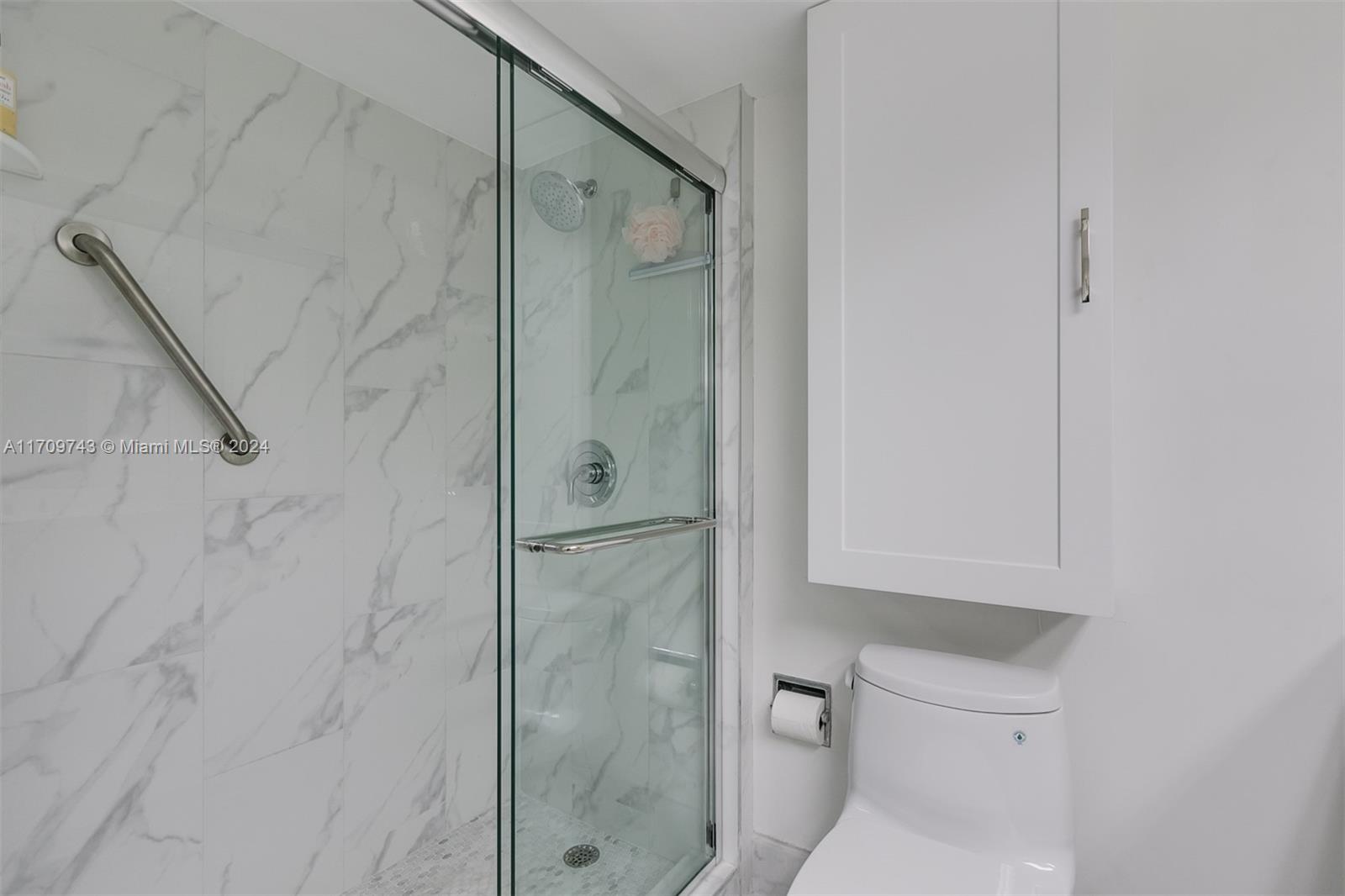 1200 South Ocean Boulevard, Unit PHF Boca Raton, FL 33432 - Photo 21 of 65 a bathroom with a shower and toilet
