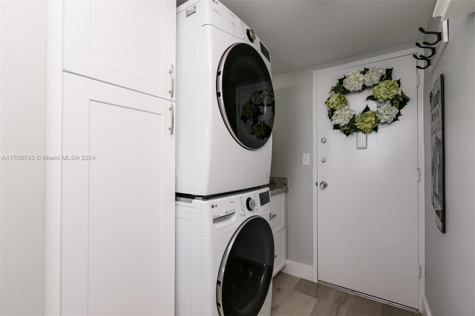 1200 South Ocean Boulevard, Unit PHF Boca Raton, FL 33432 - Photo 26 of 65 a utility room with dryer and washer