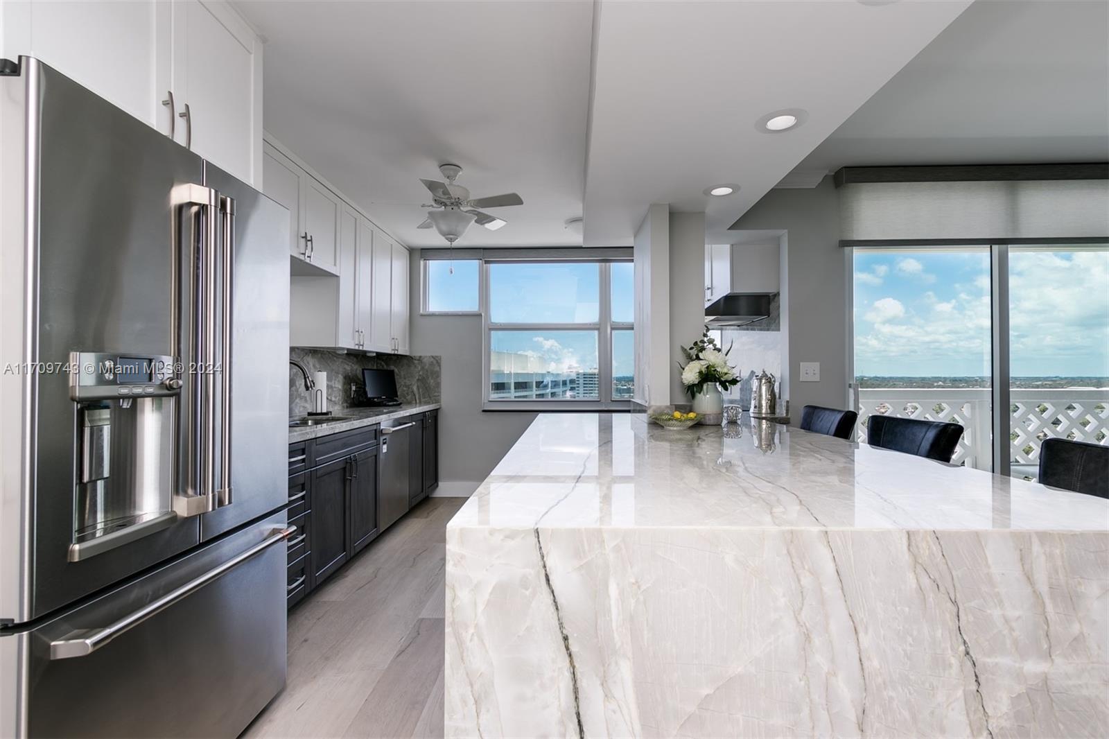 1200 South Ocean Boulevard, Unit PHF Boca Raton, FL 33432 - Photo 5 of 65 a large kitchen with stainless steel appliances lots of counter space and a refrigerator