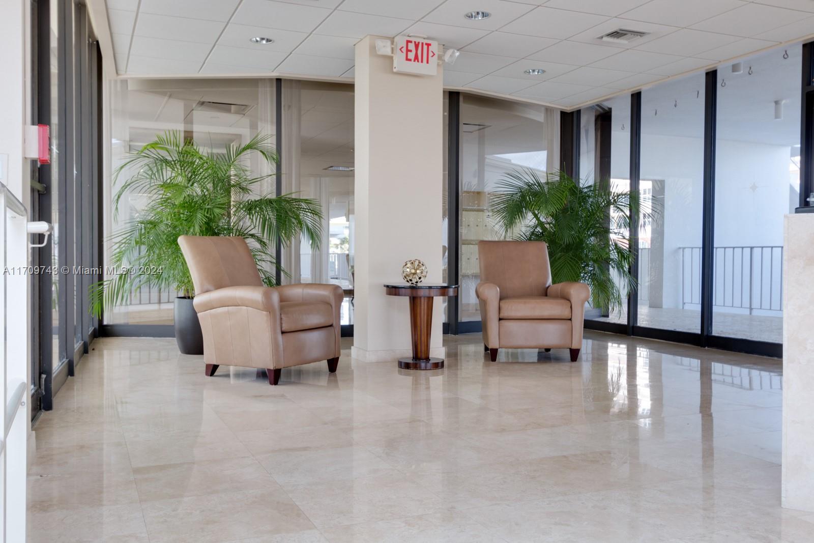 1200 South Ocean Boulevard, Unit PHF Boca Raton, FL 33432 - Photo 53 of 65 a living room with furniture and a potted plant