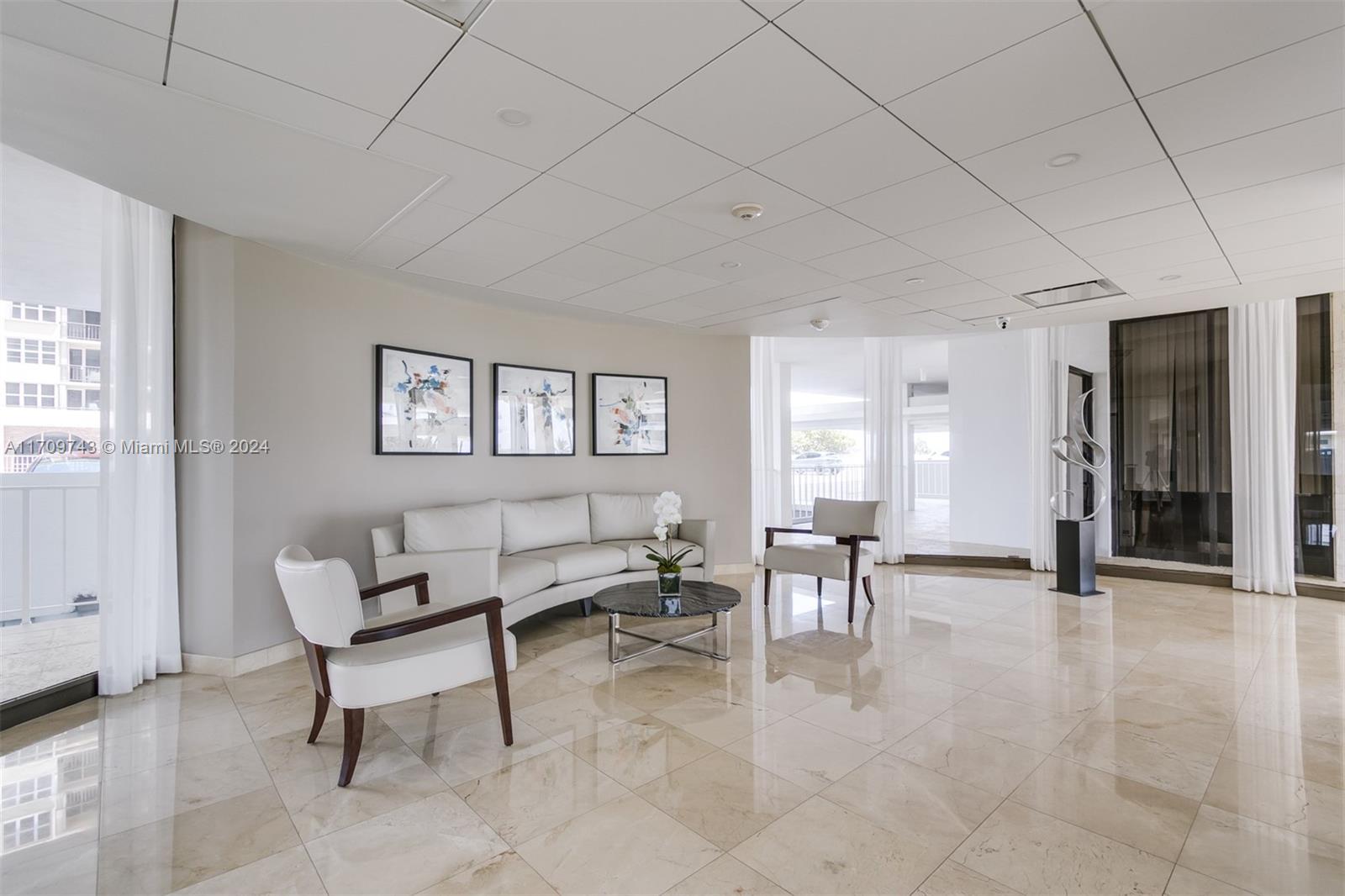 1200 South Ocean Boulevard, Unit PHF Boca Raton, FL 33432 - Photo 59 of 65 a living room with furniture and a window