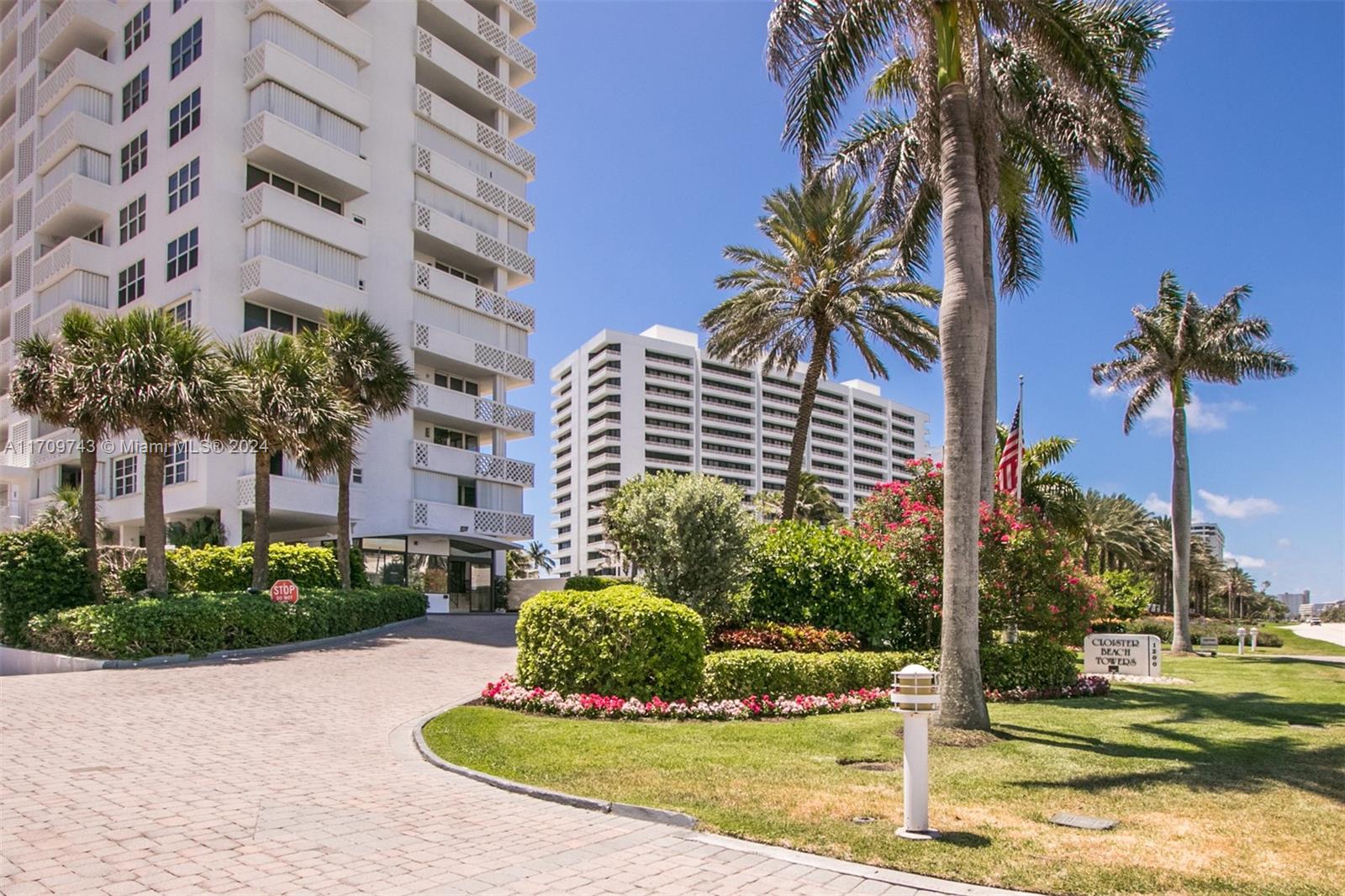 1200 South Ocean Boulevard, Unit PHF Boca Raton, FL 33432 - Photo 64 of 65 a front view of multi story residential apartment building with yard and sign board