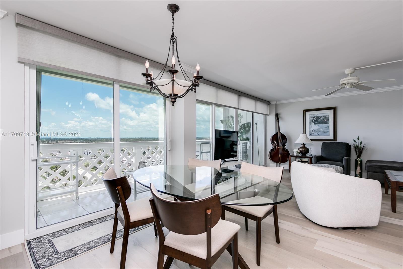 1200 South Ocean Boulevard, Unit PHF Boca Raton, FL 33432 - Photo 10 of 65 a dining room with furniture a chandelier and wooden floor