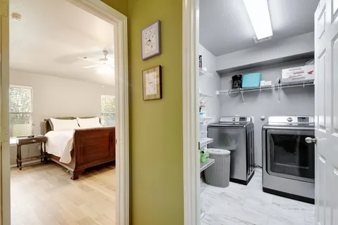 a bedroom with a bed and a view of bedroom
