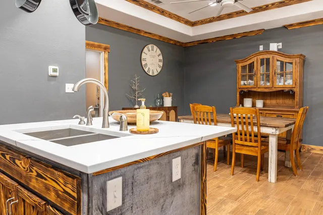 a bedroom with a bed and a flat tv screen on dresser