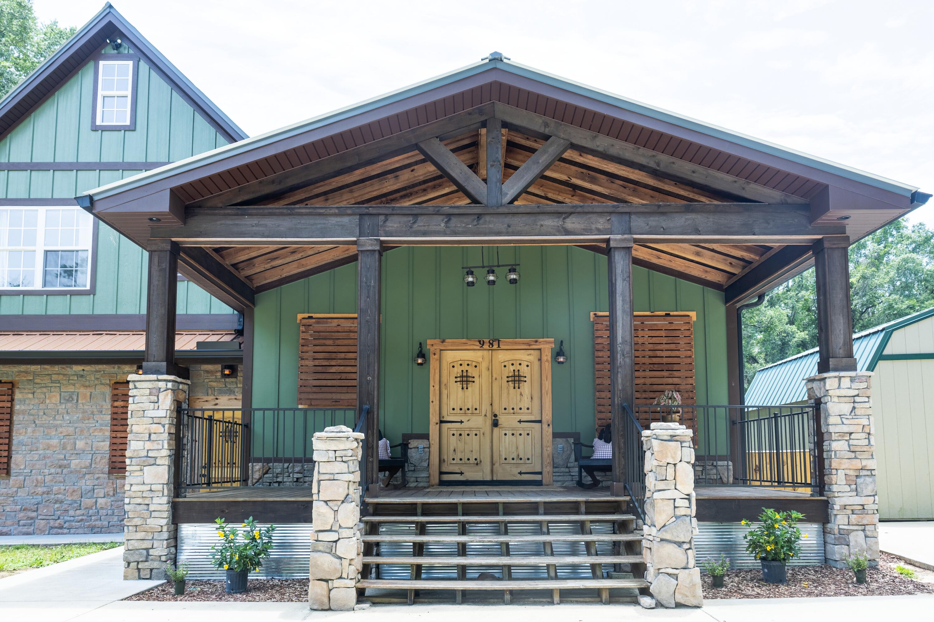 981 East Chestnut Avenue Crestview, FL 32539 - Photo 2 of 64 a front view of a house with garden
