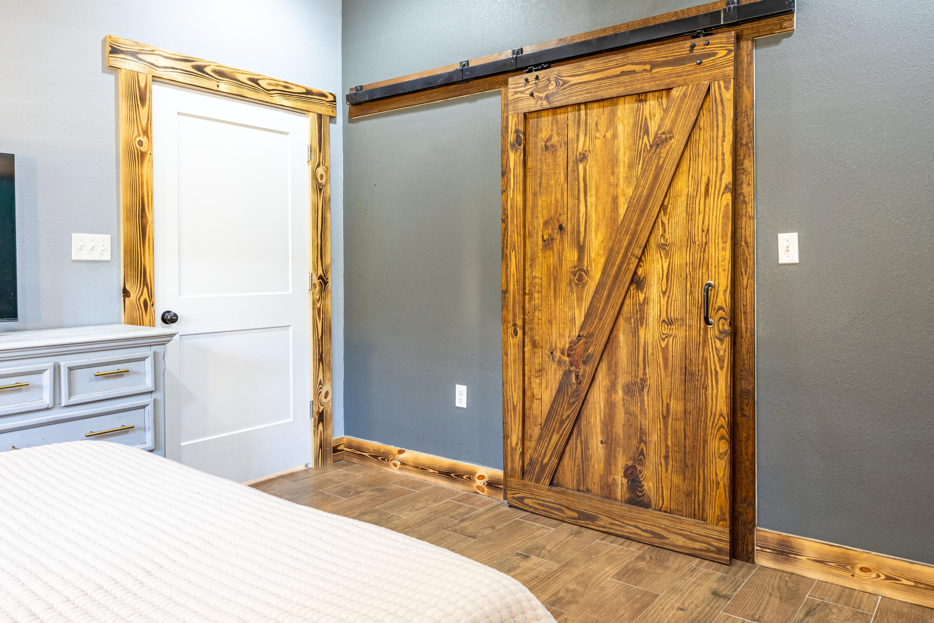 981 East Chestnut Avenue Crestview, FL 32539 - Photo 22 of 64 a bedroom with a bed and a dresser