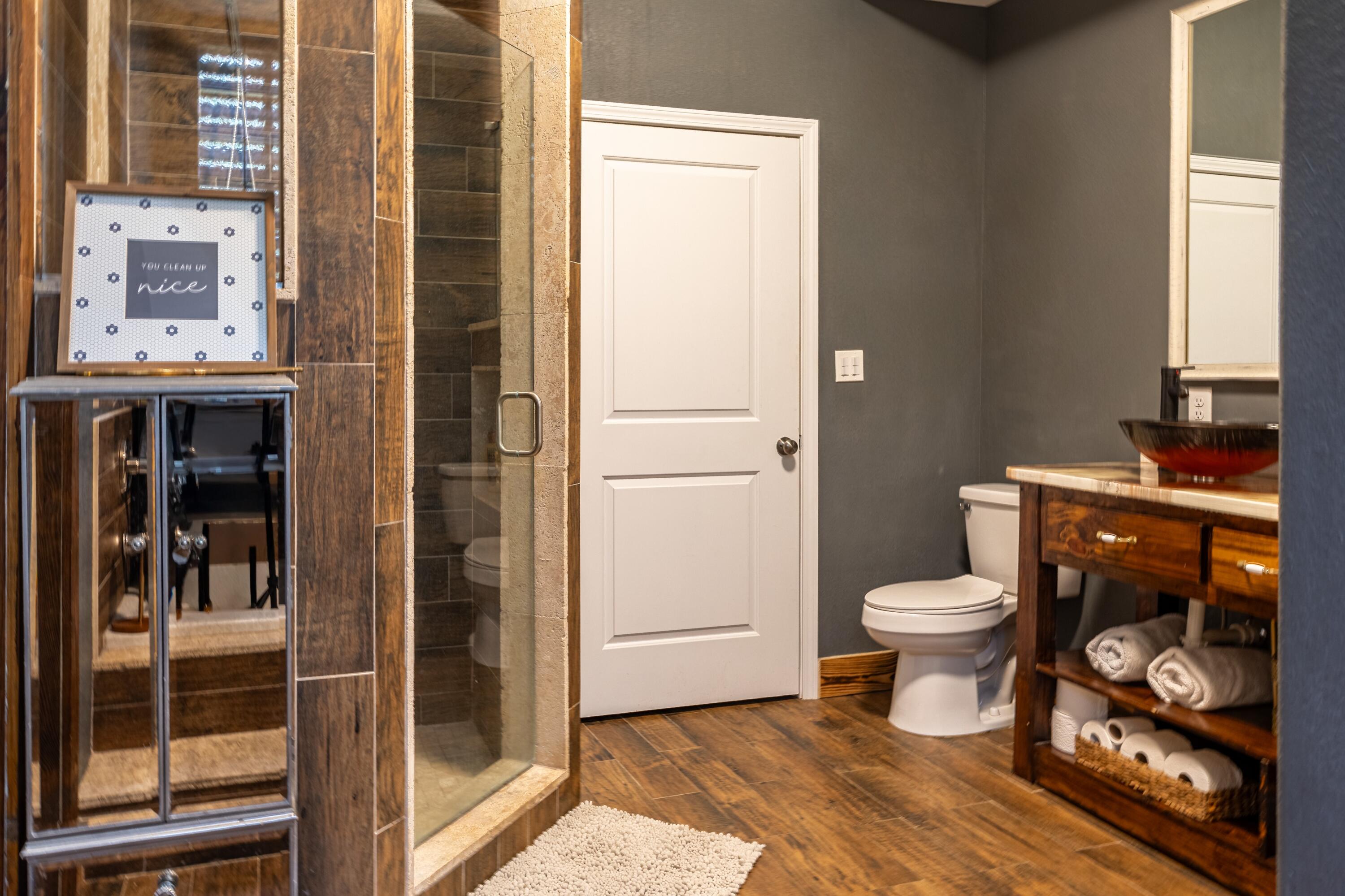 981 East Chestnut Avenue Crestview, FL 32539 - Photo 27 of 64 a bathroom with a toilet and a shower