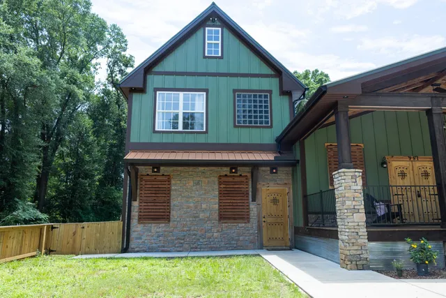 a front view of a house with garden