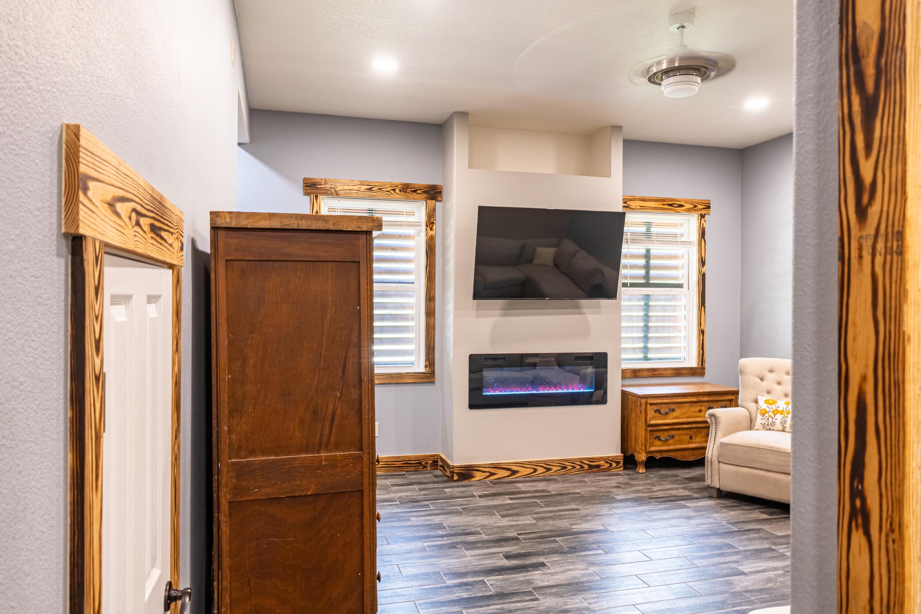981 East Chestnut Avenue Crestview, FL 32539 - Photo 32 of 64 a living room with furniture and a flat screen tv