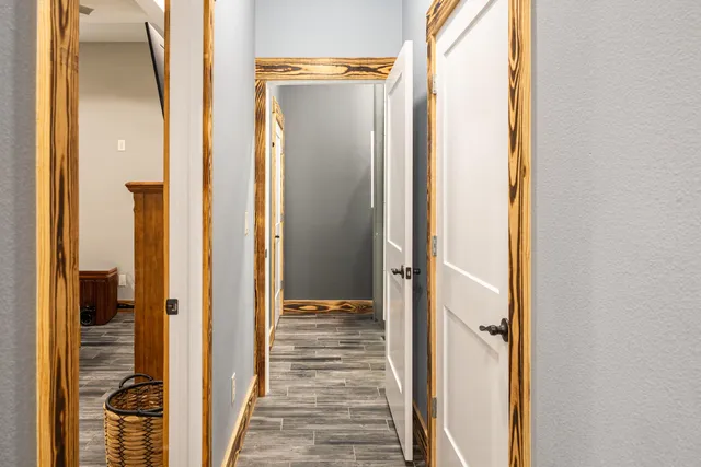a bedroom with a bed and cabinets
