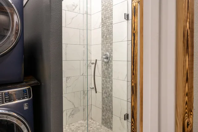 a view of workspace with wooden floor windows cabinet and chair