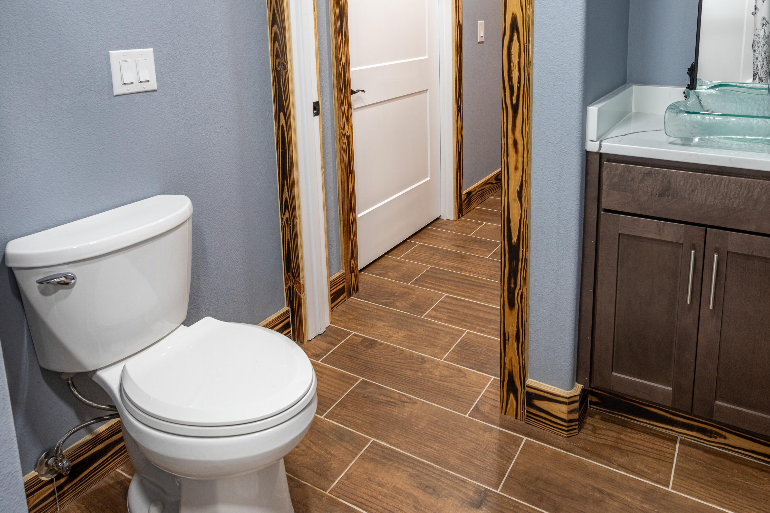 981 East Chestnut Avenue Crestview, FL 32539 - Photo 40 of 64 a bathroom with a toilet and a sink