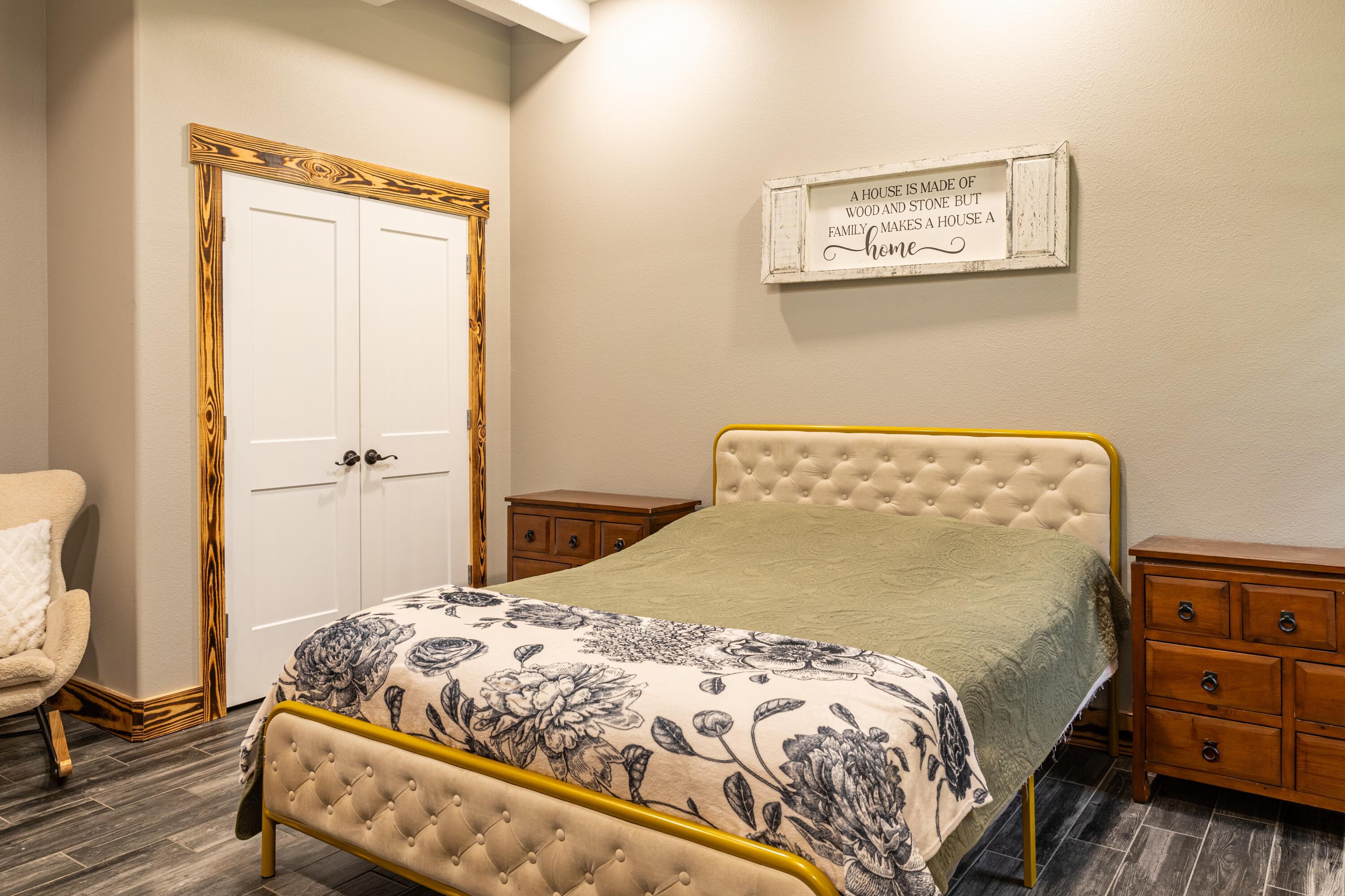 981 East Chestnut Avenue Crestview, FL 32539 - Photo 43 of 64 a bedroom with a bed and cabinets