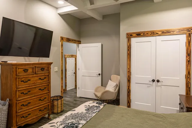 a bedroom with a bed and a dresser