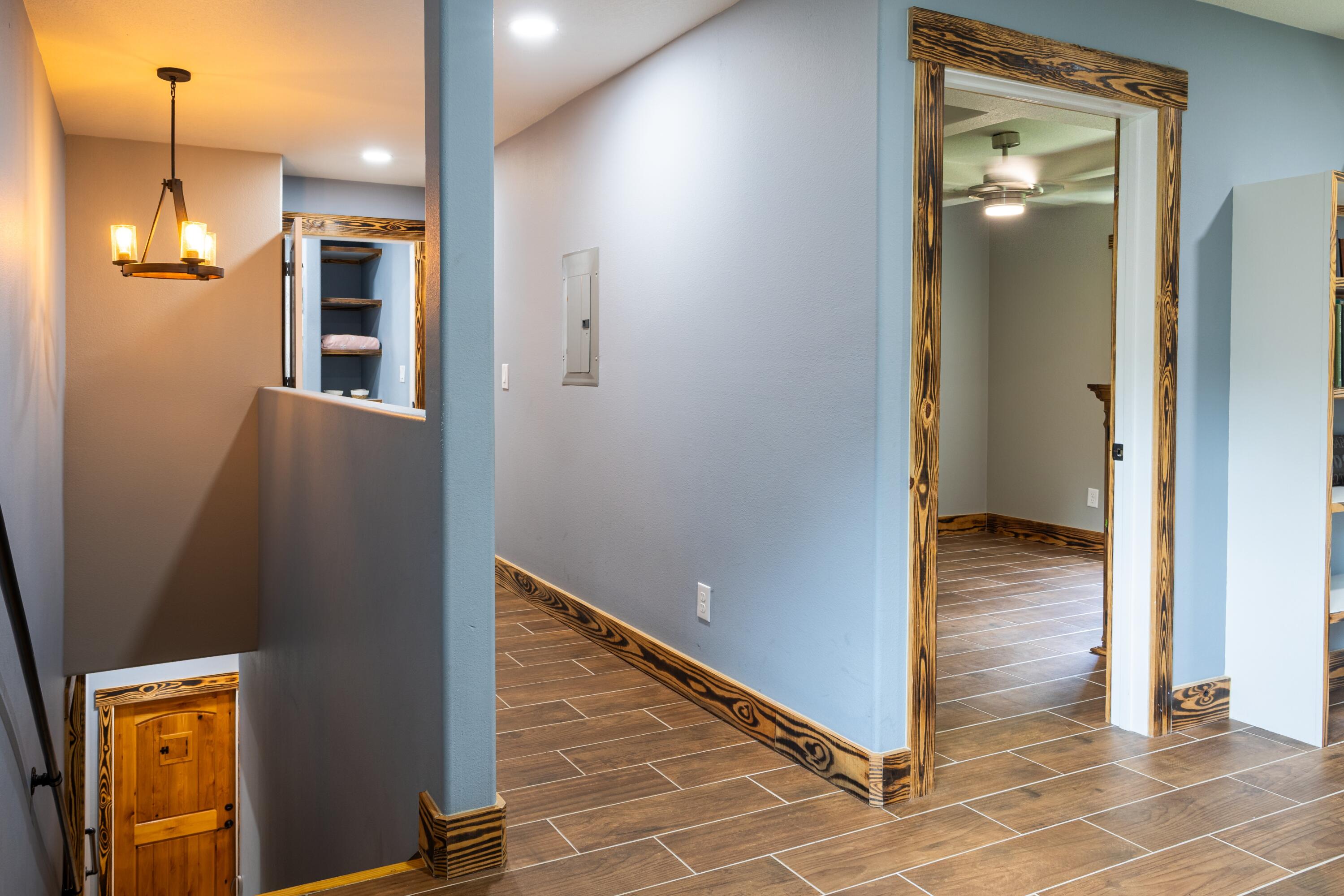 981 East Chestnut Avenue Crestview, FL 32539 - Photo 45 of 64 a view of a hallway with wooden floor