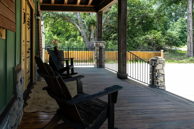 a view of a balcony with chairs
