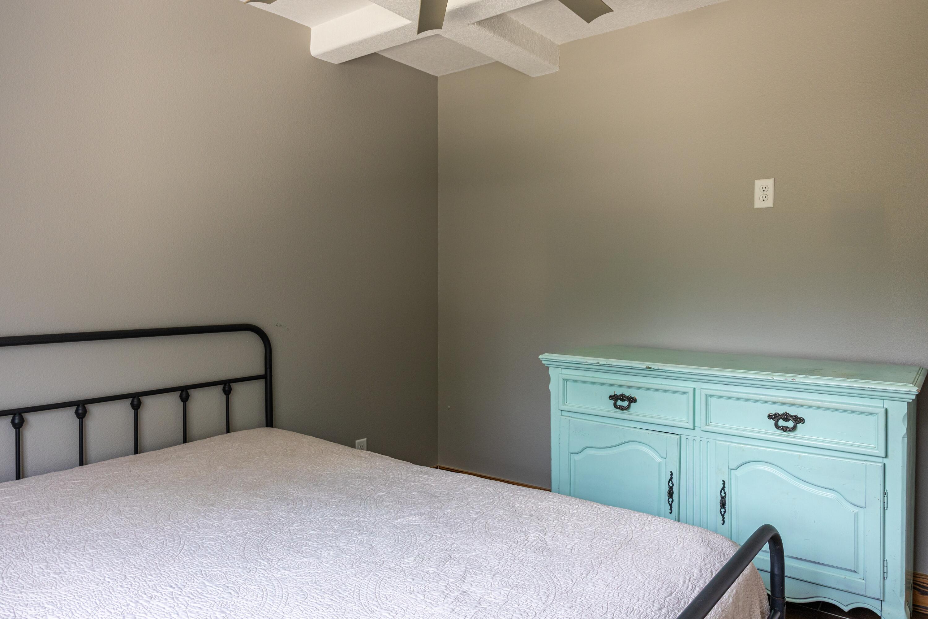 981 East Chestnut Avenue Crestview, FL 32539 - Photo 55 of 64 a bedroom with a bed and a dresser