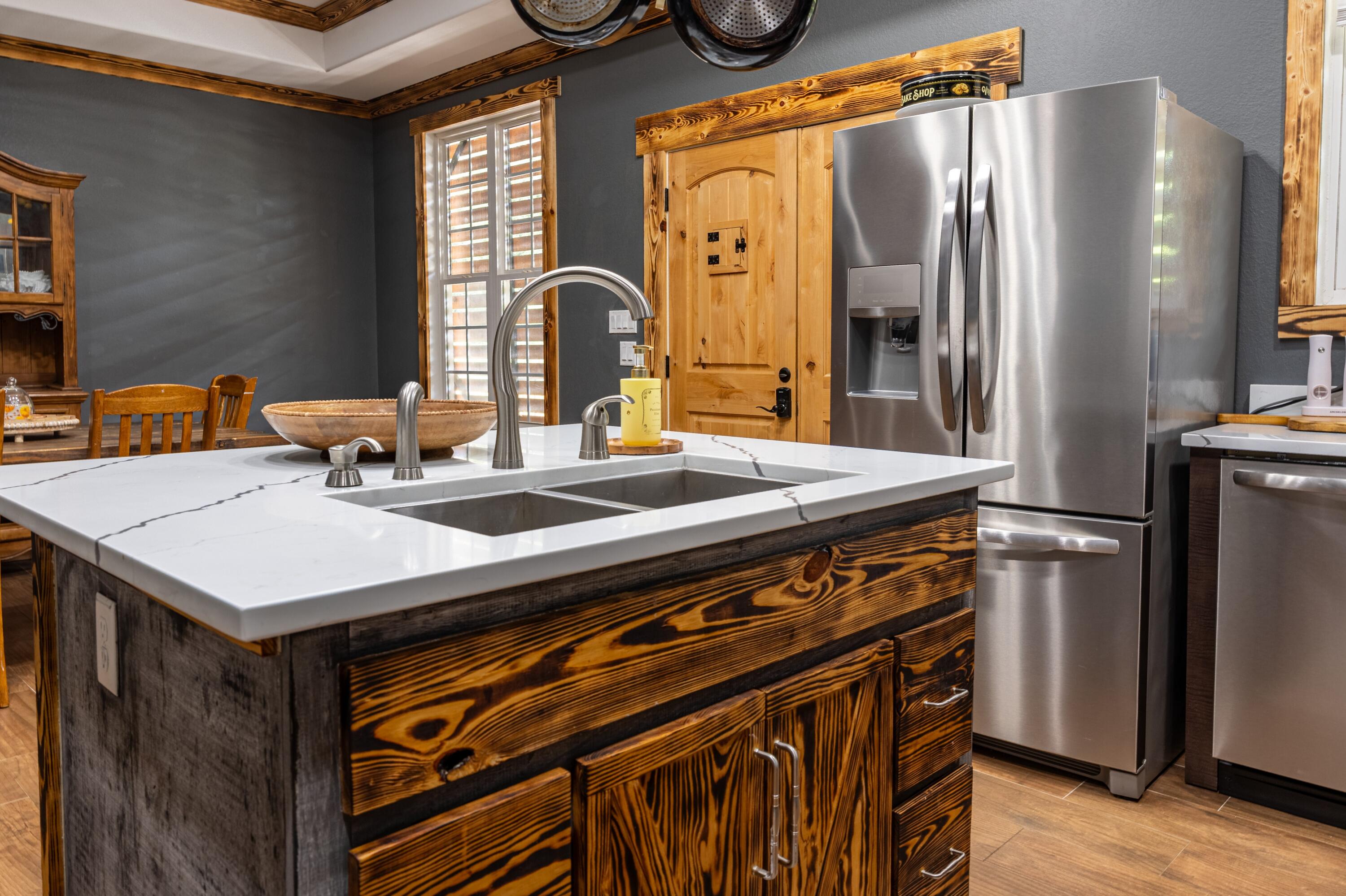 981 East Chestnut Avenue Crestview, FL 32539 - Photo 10 of 64 a kitchen with stainless steel appliances a stove a refrigerator and a dining table