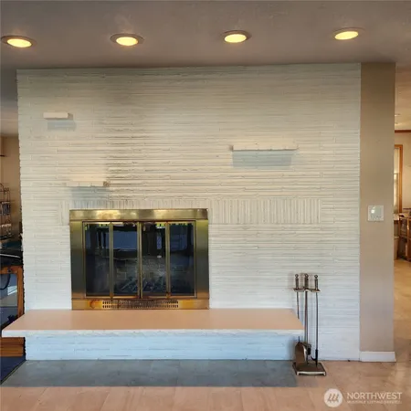 a view of balcony with wooden floor and outdoor seating