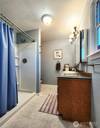 a view of room with furniture and a large window