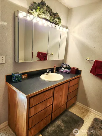 a kitchen with stainless steel appliances kitchen island a stove and a sink