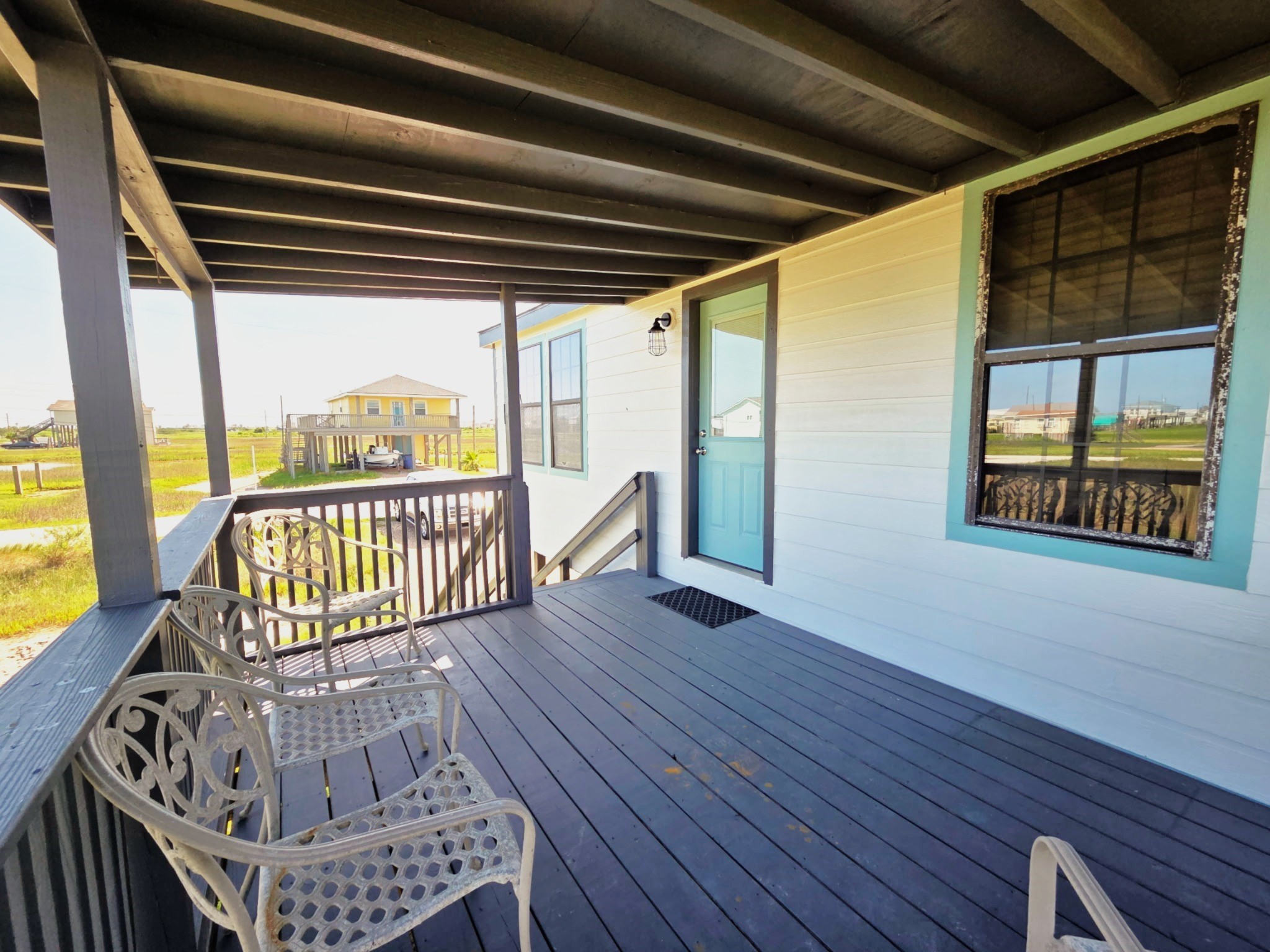 714 Caisson Street Surfside Beach, TX 77541 - Photo 2 of 12 a view of a porch with wooden floor