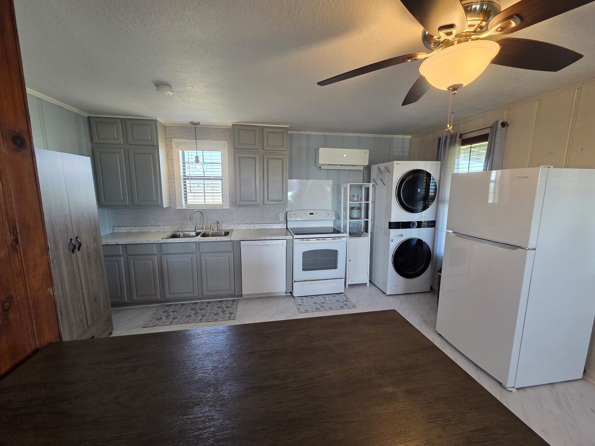 714 Caisson Street Surfside Beach, TX 77541 - Photo 4 of 12 a kitchen with a cabinets and a stove top oven