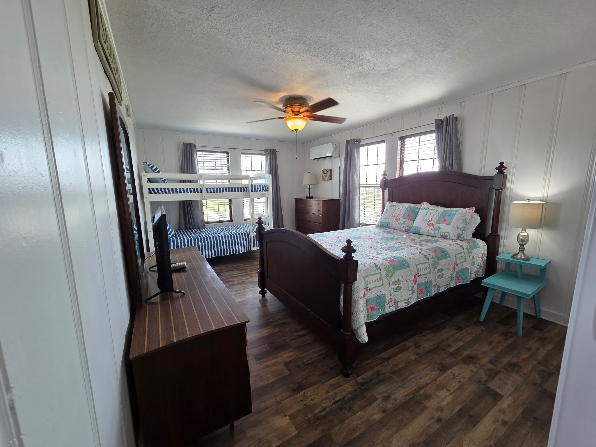 714 Caisson Street Surfside Beach, TX 77541 - Photo 7 of 12 a bedroom with a bed and wooden floor