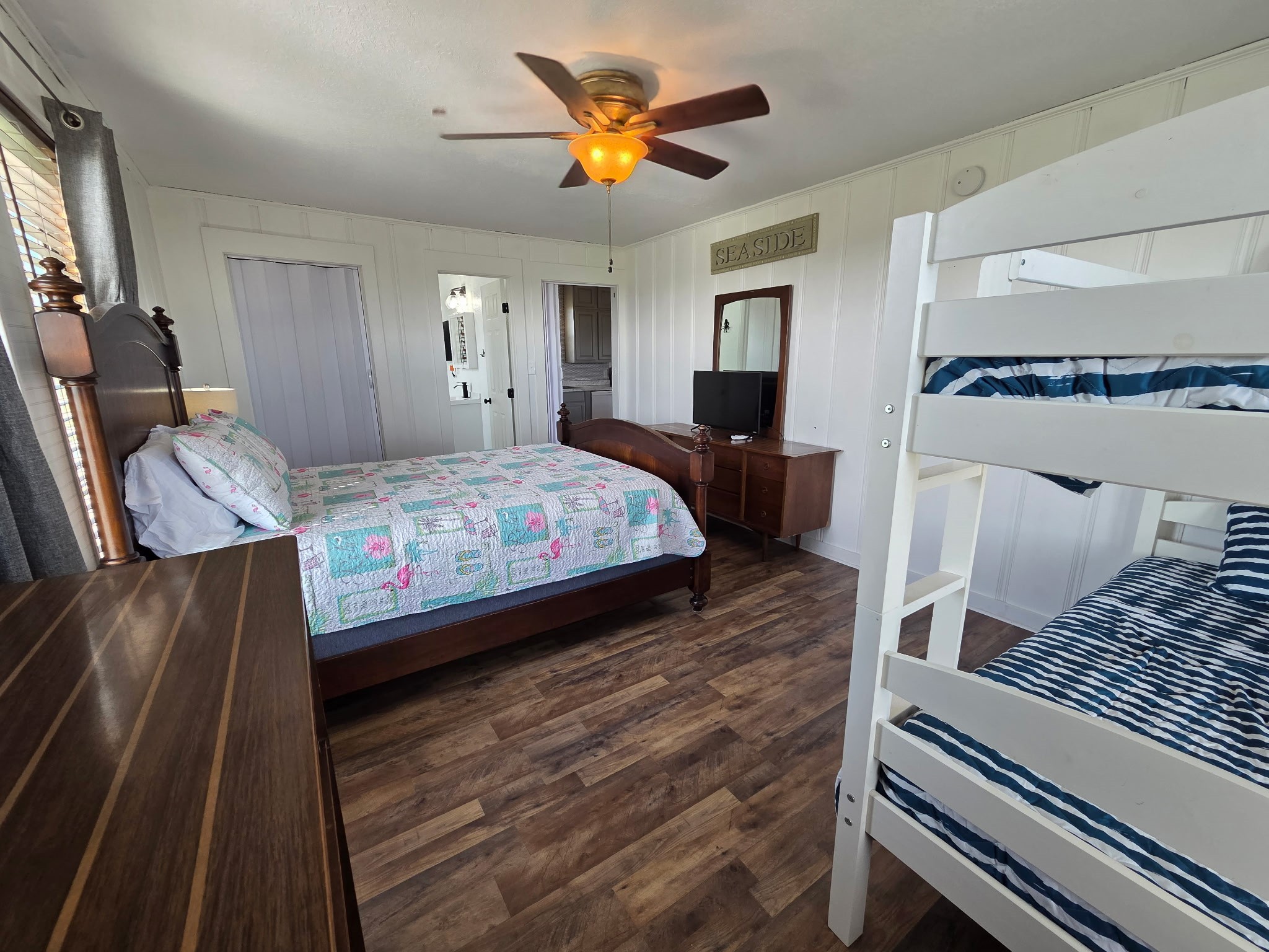 714 Caisson Street Surfside Beach, TX 77541 - Photo 9 of 12 a bedroom with a bed and wooden floor