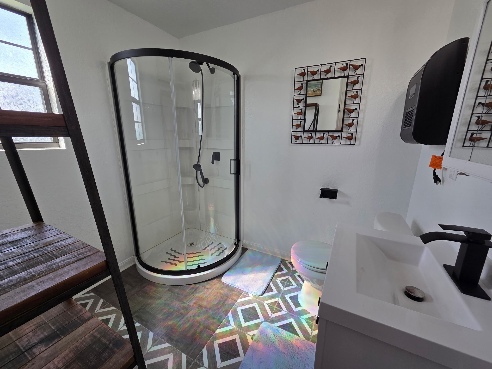 714 Caisson Street Surfside Beach, TX 77541 - Photo 10 of 12 a bathroom with a sink and mirror with bathtub