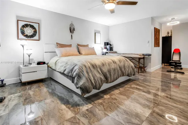 a bed room with a bed and a chair