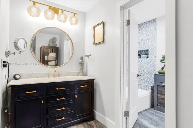 a bathroom with a sink and a mirror