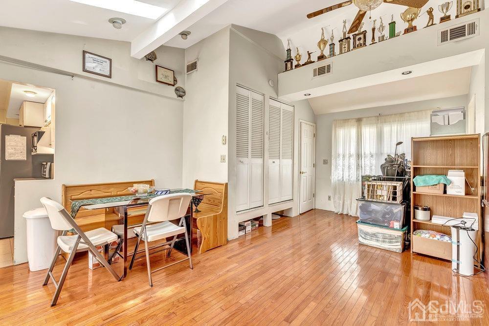 122 Vineyard Road Edison, NJ 08817 - Photo 14 of 24 a view of a livingroom with furniture and a wooden floor
