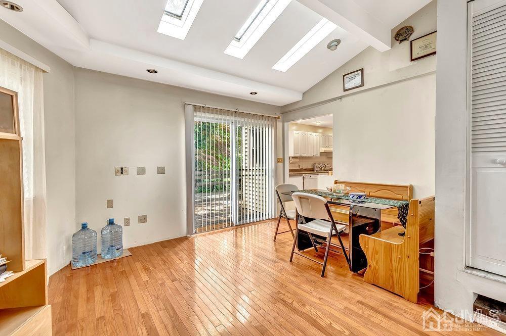 122 Vineyard Road Edison, NJ 08817 - Photo 15 of 24 a view of a dining room with furniture and wooden floor